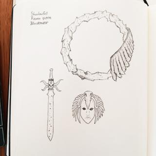 Hand-drawn raven token sketch in a sketchbook